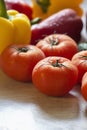 Large and bright tomatoes on the kitchen table