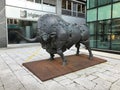 A large bronze bull sculpture at the intersection of Slovenska cesta & Trdinova ulica in Ljubljana, Slovenia.