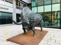 A large bronze bull sculpture at the intersection of Slovenska cesta & Trdinova ulica in Ljubljana, Slovenia.