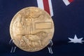 Large bronze dead man`s penny on Australian flag.