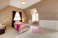 Large brown baby girl bedroom with pink bed.