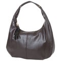 Large brown leather women`s bag bag, with one long handle, on a white background Royalty Free Stock Photo