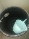 Large bucket of water in the bathroom Royalty Free Stock Photo