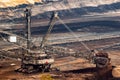 Large bucket wheel excavator mining machine at work in a brown coal open pit mine