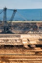 Large bucket wheel excavator mining machine at work in a brown coal open pit mine