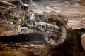 Large bucket wheel excavator mining machine at work in a brown coal open pit mine