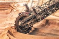 Large bucket wheel excavator mining machine at work in a brown coal open pit mine