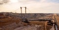 Large bucket wheel excavator mining machine at work in a brown coal open pit mine Royalty Free Stock Photo