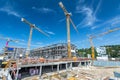 Large building site with foundations, cranes, scaffolding and partly finished buildings Royalty Free Stock Photo