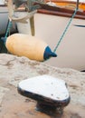 Buoy white and blue on a sailing hull and mooring column