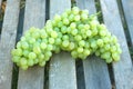 Large bunch of white grapes on old table Royalty Free Stock Photo