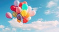 A large bunch of yellow Helium ballons straining on their strings against a sunny sky with white clouds Royalty Free Stock Photo