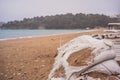 large burlap or hessian sandbags stopping soil erosion on a beach during high tide and stormy days Royalty Free Stock Photo