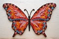 large butterfly mural created from tiny mosaic tiles