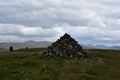 Large Cairn Waymarker at the Summit of a Large Hill