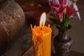 Large Candle and Fire With Flower Background Royalty Free Stock Photo