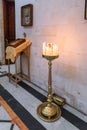 Large candlestick with sand and burning candles in Alexander Nevsky church in Jerusalem, Israel