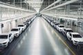 large car factory, with rows of newly assembled vehicles on the assembly line