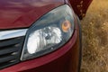 Large car headlights close-up, technical road lighting day and night. Royalty Free Stock Photo