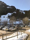 A Large Car Park In A Ski Resort With Rows Of Various Cars Of Holidaymakers