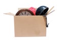 A large cardboard box filled with Yard Sale or Tag Sale items to be sold at a discount in order to make room and make some money Royalty Free Stock Photo