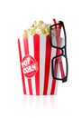 Large cardboard striped glass with popcorn and 3D glasses isolated on white background, reflection Royalty Free Stock Photo