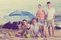 Large carefree family of six people together on beach Royalty Free Stock Photo