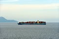 Large cargo container ship sailing near Japan.