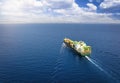 A large cargo container ship traveling over the open ocean Royalty Free Stock Photo