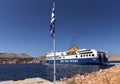 The large cargo and passenger ferry Blue Star moors to the pier of Symi Island