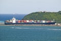 Large cargo ship bringing cargo containers to Durban, South Africa on the Indian Ocean