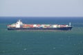 Large cargo ship bringing cargo containers to Durban, South Africa on the Indian Ocean