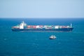 Large cargo ship bringing cargo containers to Durban, South Africa on the Indian Ocean