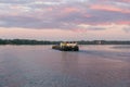 Yaroslavl region, Russia, July 8, 2023. Large self-propelled barge on the river at sunset. Royalty Free Stock Photo