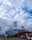 Large cargo ship moored at a dock station with no cargo visible on the vessel Royalty Free Stock Photo