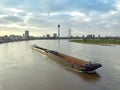 A large cargo ship sailing on the river Rhine in the German city of Dusseldorf. River barge Royalty Free Stock Photo