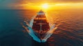A large cargo ship sails through the ocean at sunset Royalty Free Stock Photo