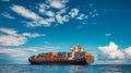 A large cargo ship is seen in the middle of the ocean, carrying containers as part of its transportation operations Royalty Free Stock Photo
