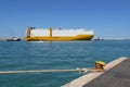 Large Cargo Ship Towed into Port by two small Tugboats Royalty Free Stock Photo