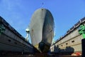 Large cargo vessels repaired in dry dock in shipyard