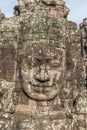 Large carved stone head at Bayon temple in Angkor Archaeological Park, near Siem Reap, Cambodia