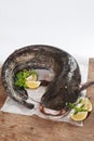 Large catfish on wooden table