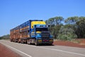 Large cattle trailer road train on outback road in North Territory Australia