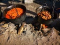 Large cauldrons with shredded cabbage with vegetables and pork cracklings