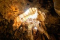 Large cavity limestone cave sunlight shine under earth