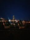 large cement factory, kind of at night, lamps are lit