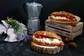 Large cereal croissant with cottage cheese and fresh strawberries on a dark background. Tasty breakfast. Royalty Free Stock Photo