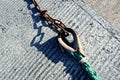 a large chain hanging off a rope that is attached to a buoy Royalty Free Stock Photo