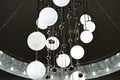 Large chandelier with round shades and metal balls Royalty Free Stock Photo