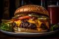 Large cheeseburger with lettuce, tomato, onion, pickle on moody dark background.